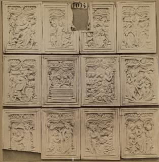 12 panels (fragments of a box), 1 register, 1 ogee arch across (plaquettes) (Group, front)
